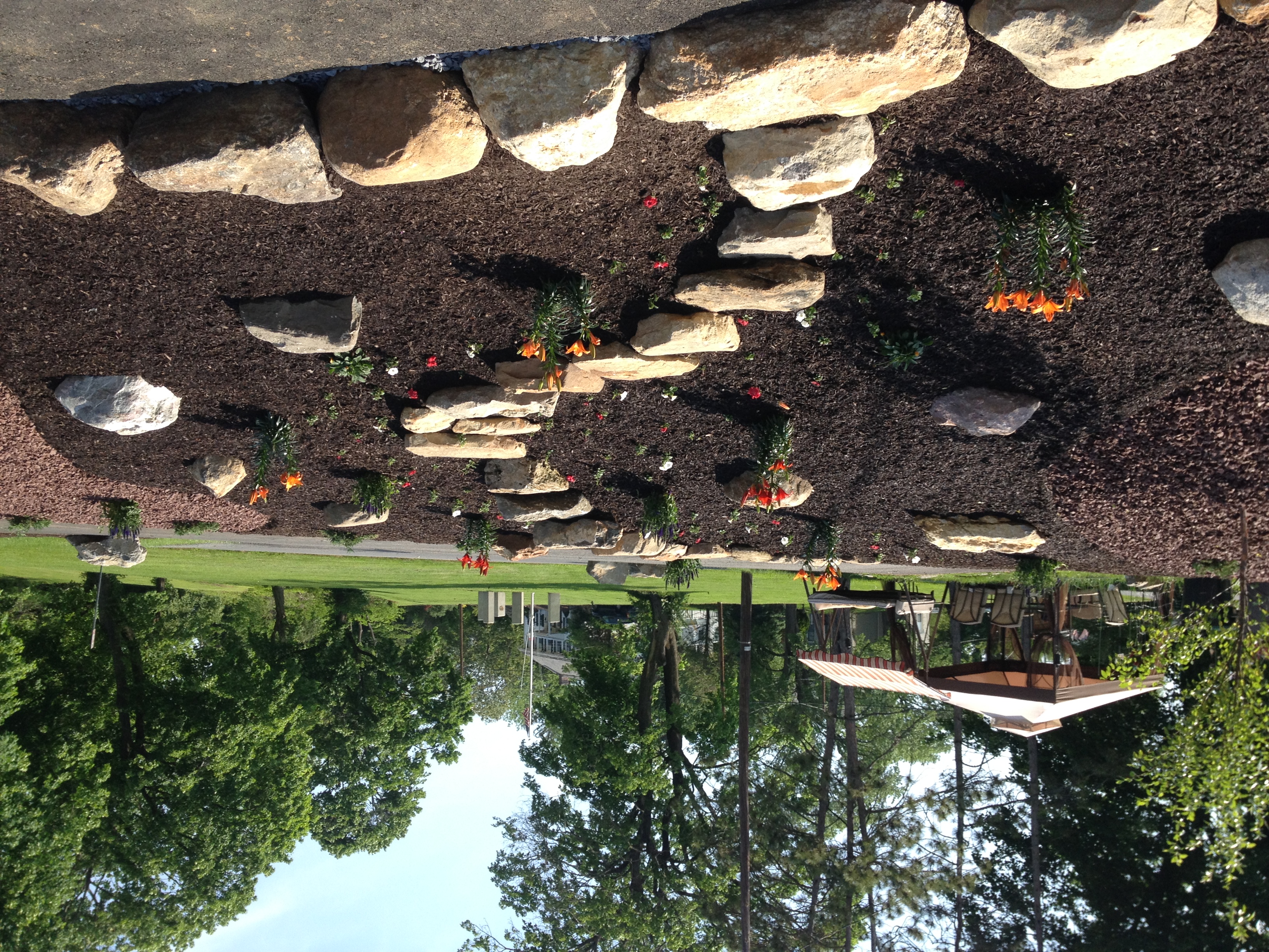 Landscape bed installation with stone edging and fresh mulch in Lehighton, PA