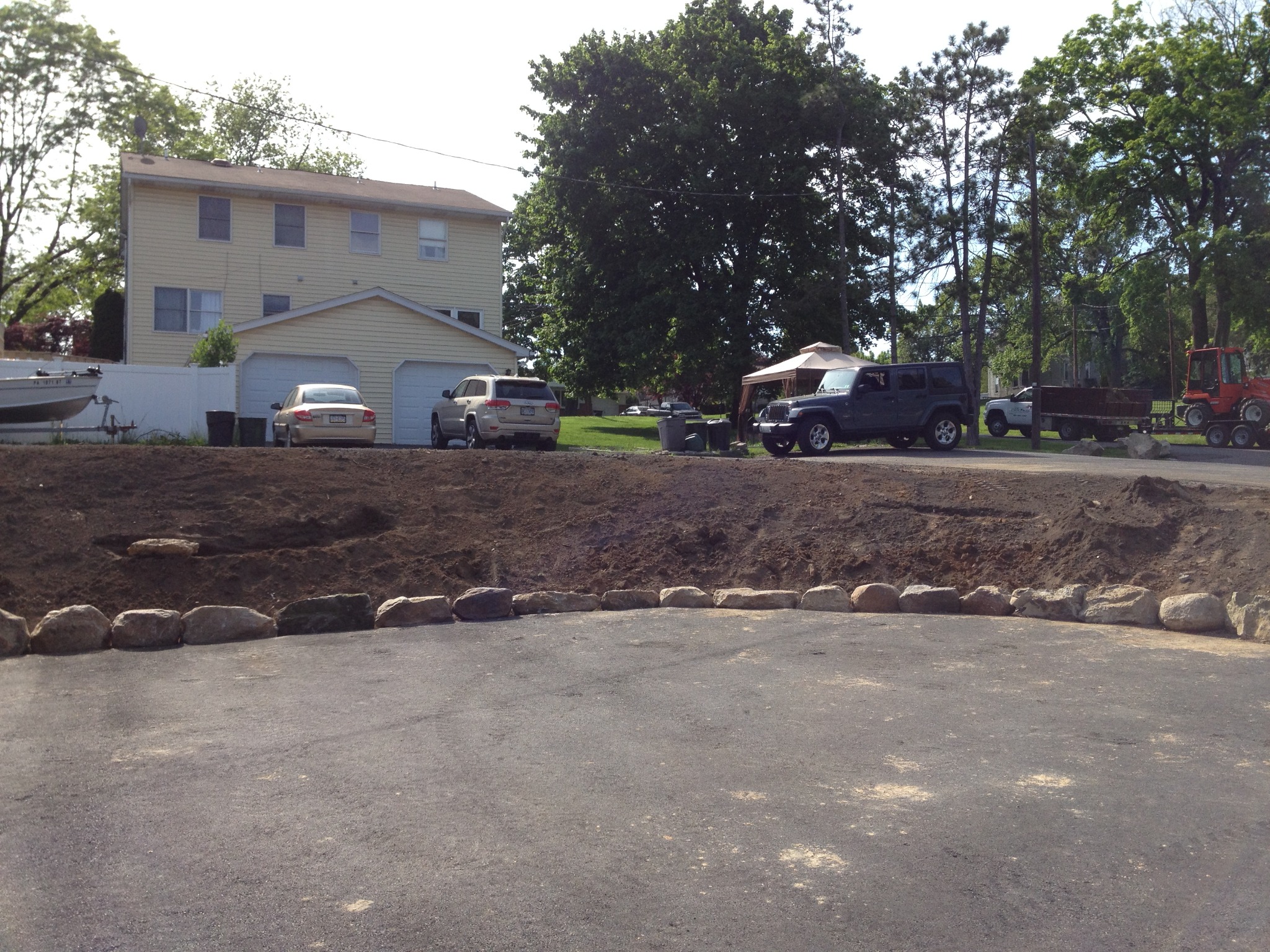 Parking lot landscape island installation overview before final planting fill-in