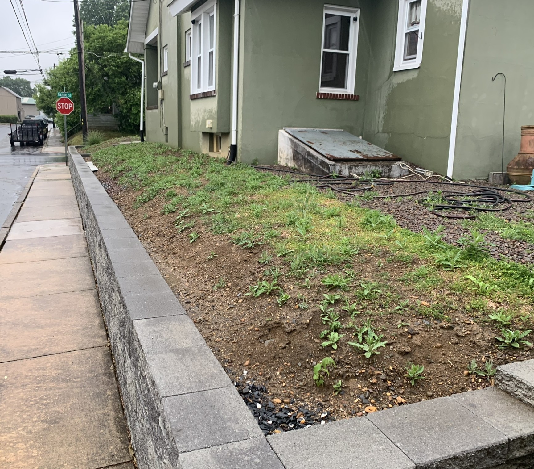 Before landscaping cleanup with overgrown shrubs and messy beds in Lehighton, PA