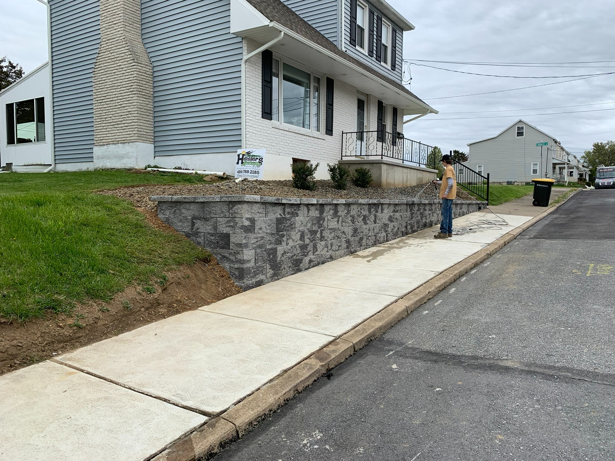 Completed front yard landscape with rock bed from alternate angle