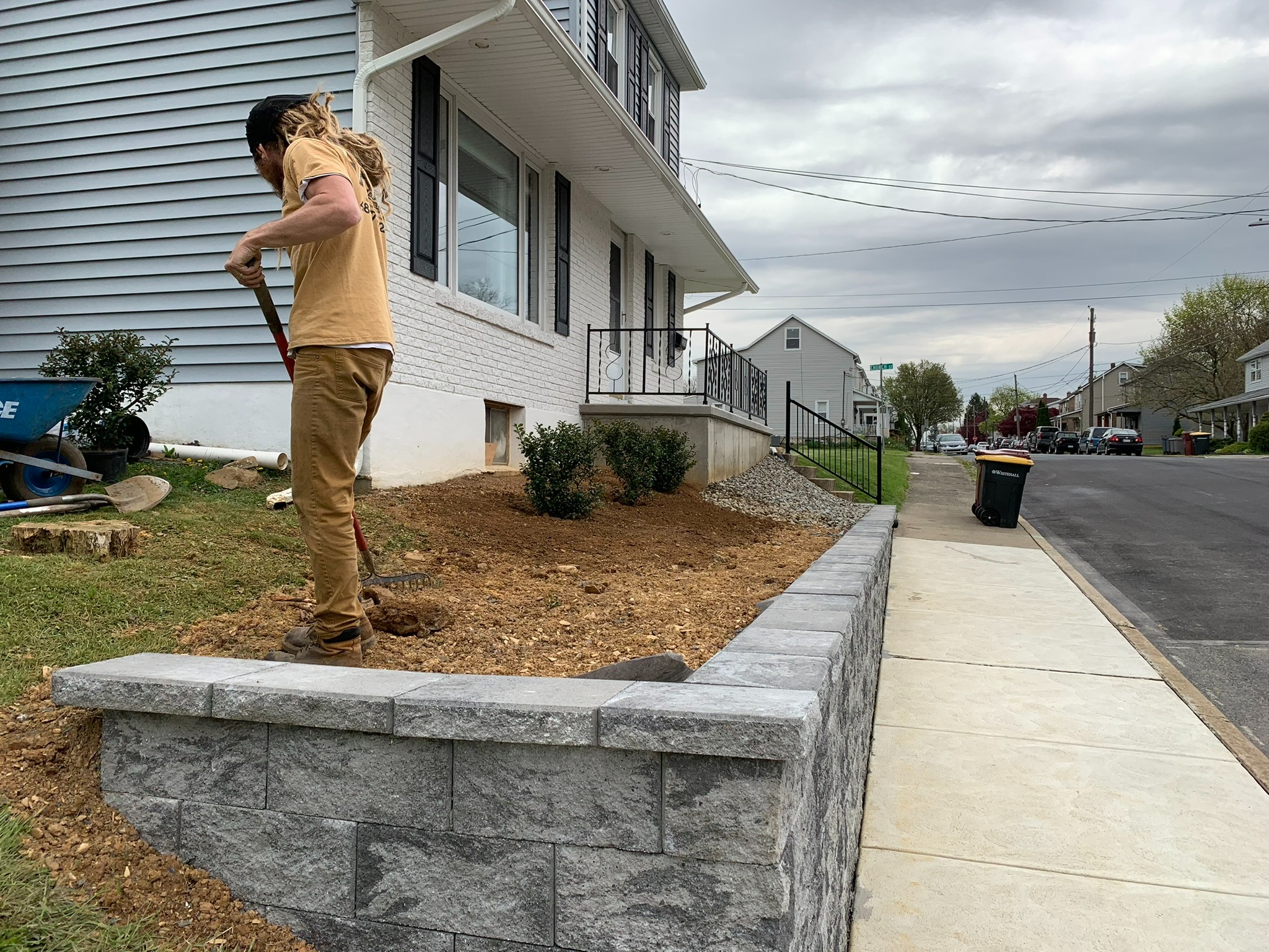 Front yard cleanup and preparation before installing stone landscape bed